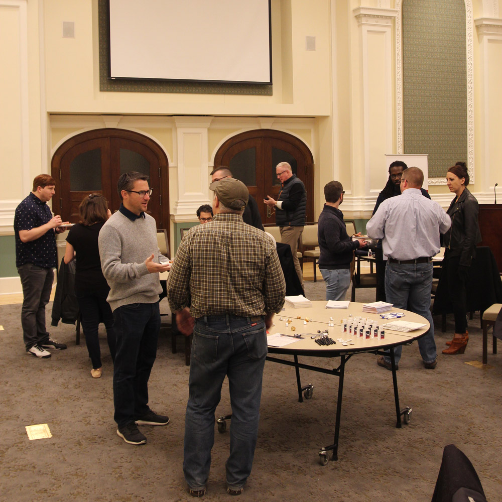 People eating pizza at the Milwaukee Sitecore User Group.